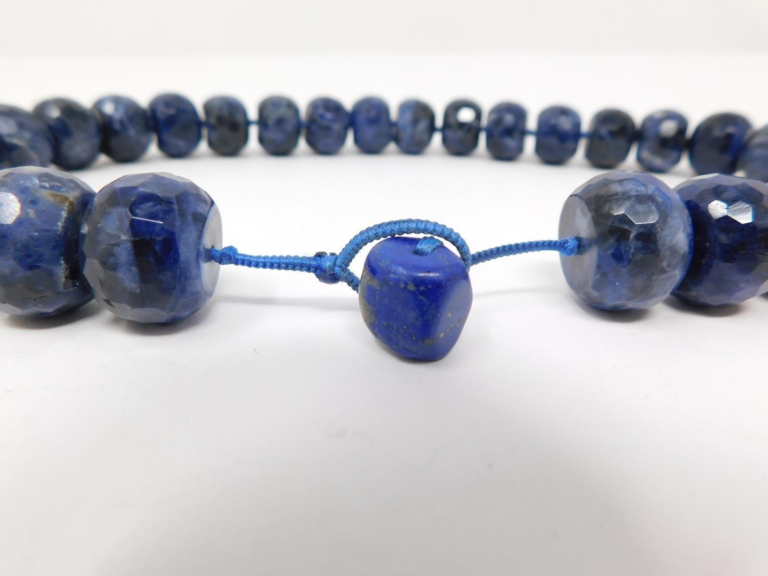 A honeycomb faceted Sodalite bead nacklace with Lapis Lazuli silk chord loop clasp. Comprised of - Image 4 of 10