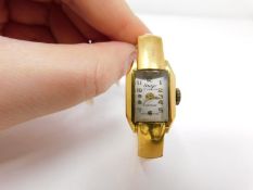 A gold plated vintage Arugo Swiss made ladies bangle watch. Diameter 4.8cm.