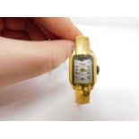 A gold plated vintage Arugo Swiss made ladies bangle watch. Diameter 4.8cm.