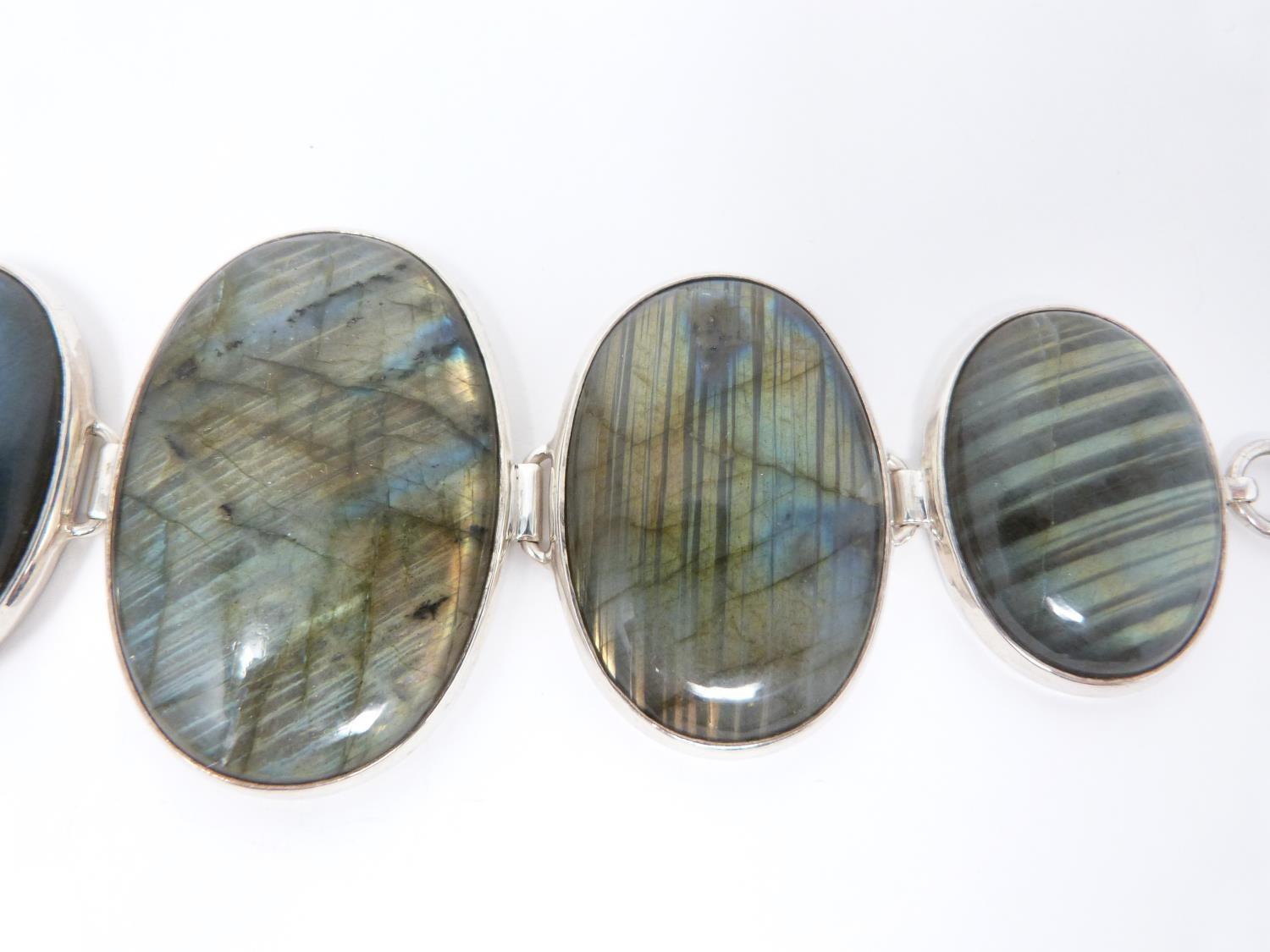 A bespoke silver and Labradorite articulated bracelet, set with five Labradorite cabochons, - Image 4 of 10