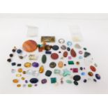 A collection of various cut gemstones, crystal and gemstone beads. Including Smokey Quartz,