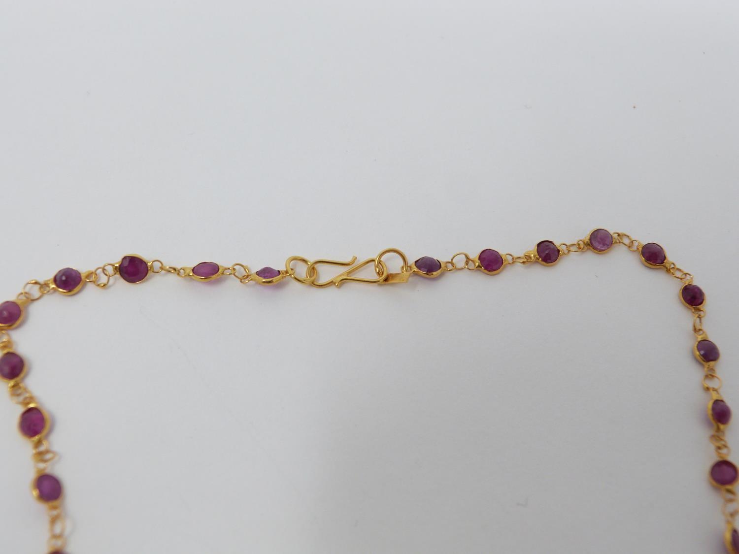 A bespoke yellow metal (tested 14 carat yellow gold) and ruby chain necklace. Set with fifty one - Image 5 of 6