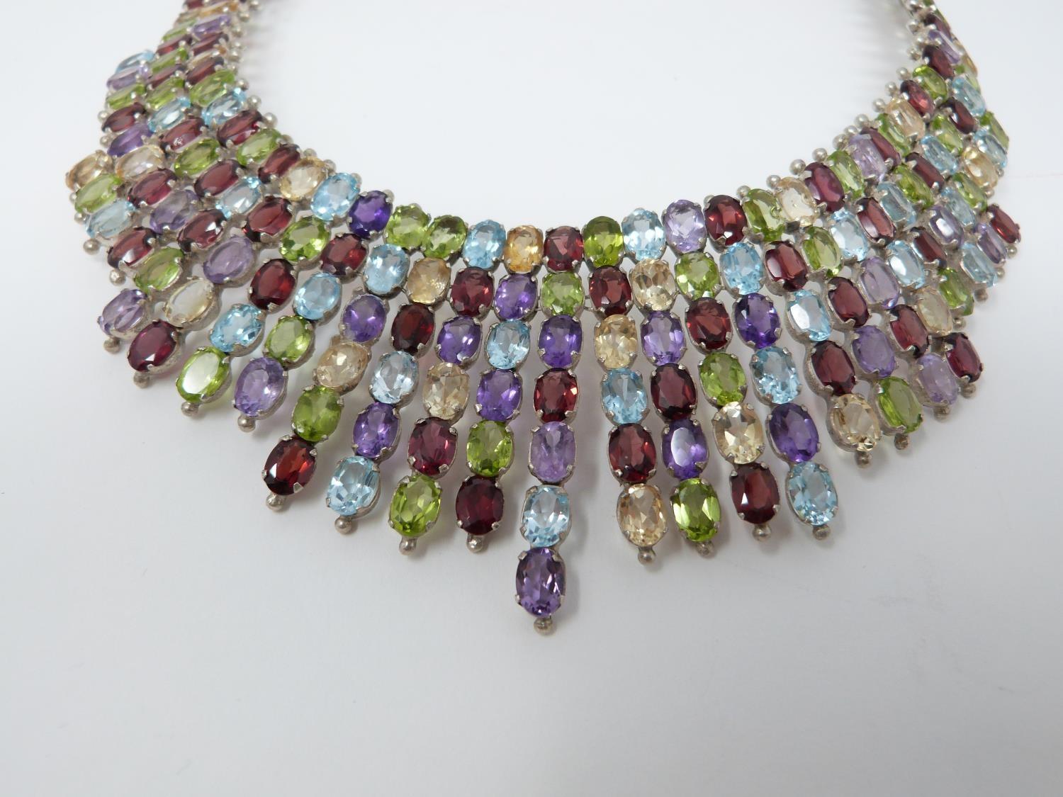 A bespoke silver and multi gemstone collar necklace, set with fifty two oval mixed cut Peridots, - Image 3 of 9