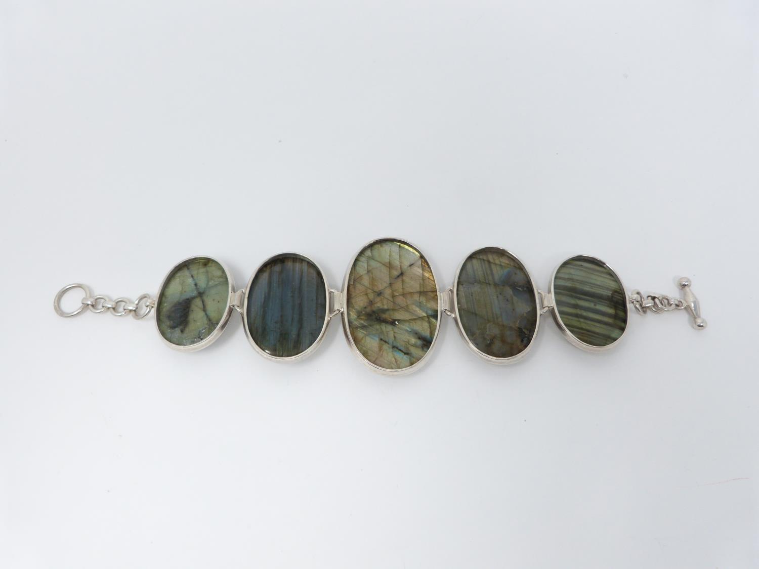 A bespoke silver and Labradorite articulated bracelet, set with five Labradorite cabochons, - Image 6 of 10