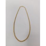 A 9 carat yellow gold Rolo link chain, hallmarked 9 carat gold with seire C-clasp. 48 cm in