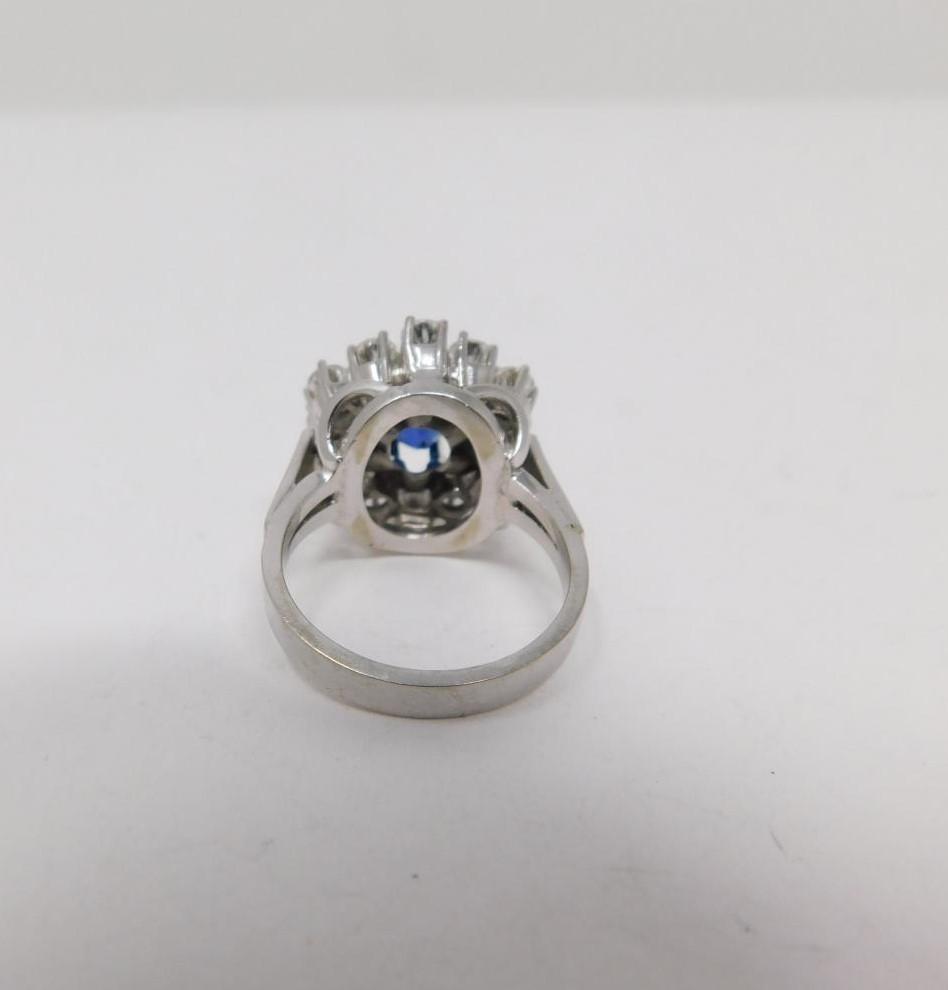 A vintage 14 carat white gold sapphire and diamond cluster ring. Set to center with an oval mixed - Image 3 of 11