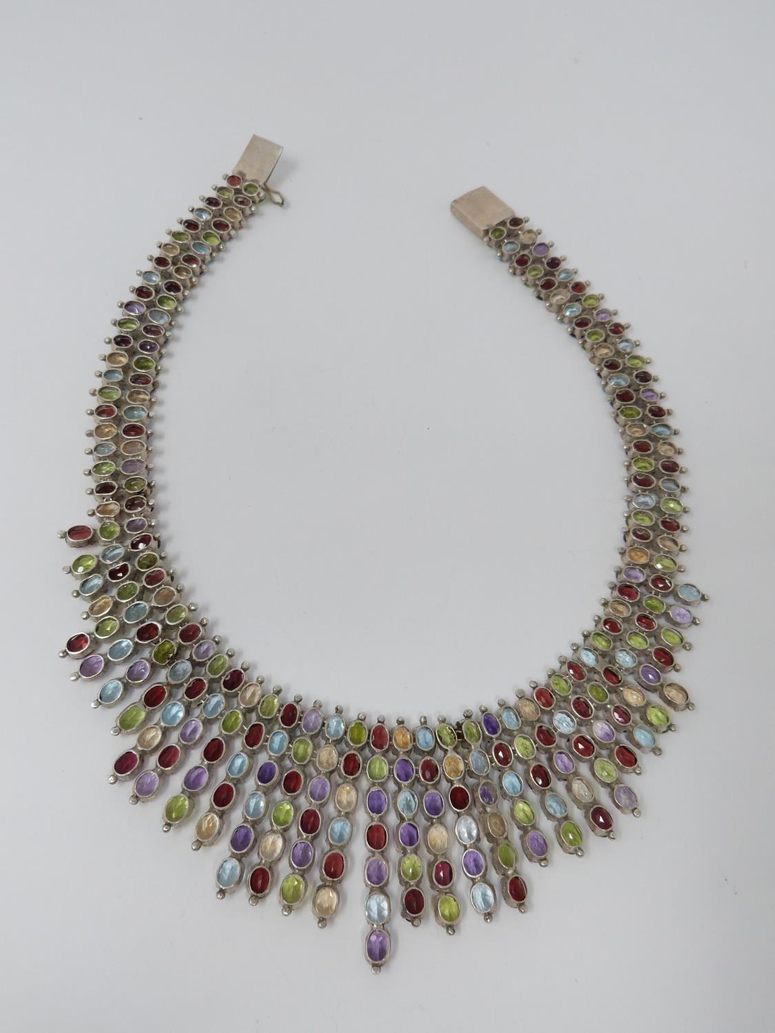 A bespoke silver and multi gemstone collar necklace, set with fifty two oval mixed cut Peridots, - Image 5 of 9