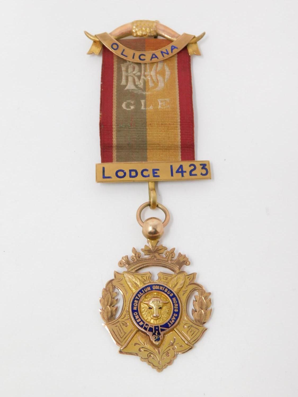 A 9 ct rose gold and enamel engraved Masonic lodge 1423 medal on an embroidered silk ribbon.