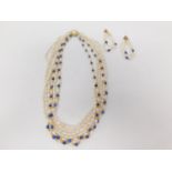 A vintage six stranded cultured pearl and lapis lazuli necklace and matching clip earrings. The