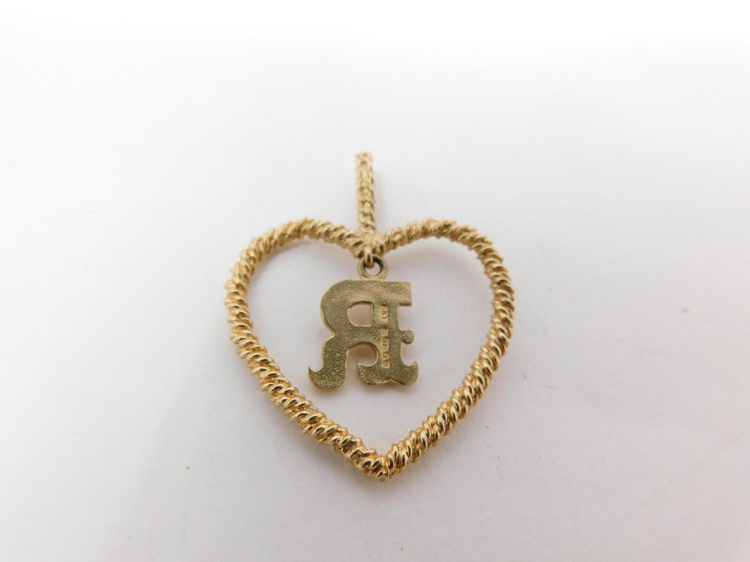 A 9carat gold chain with yellow metal dice charm and three 9 carat gold pendants. One pendant - Image 7 of 11