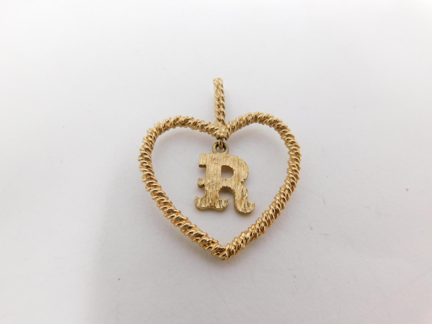 A 9carat gold chain with yellow metal dice charm and three 9 carat gold pendants. One pendant - Image 6 of 11