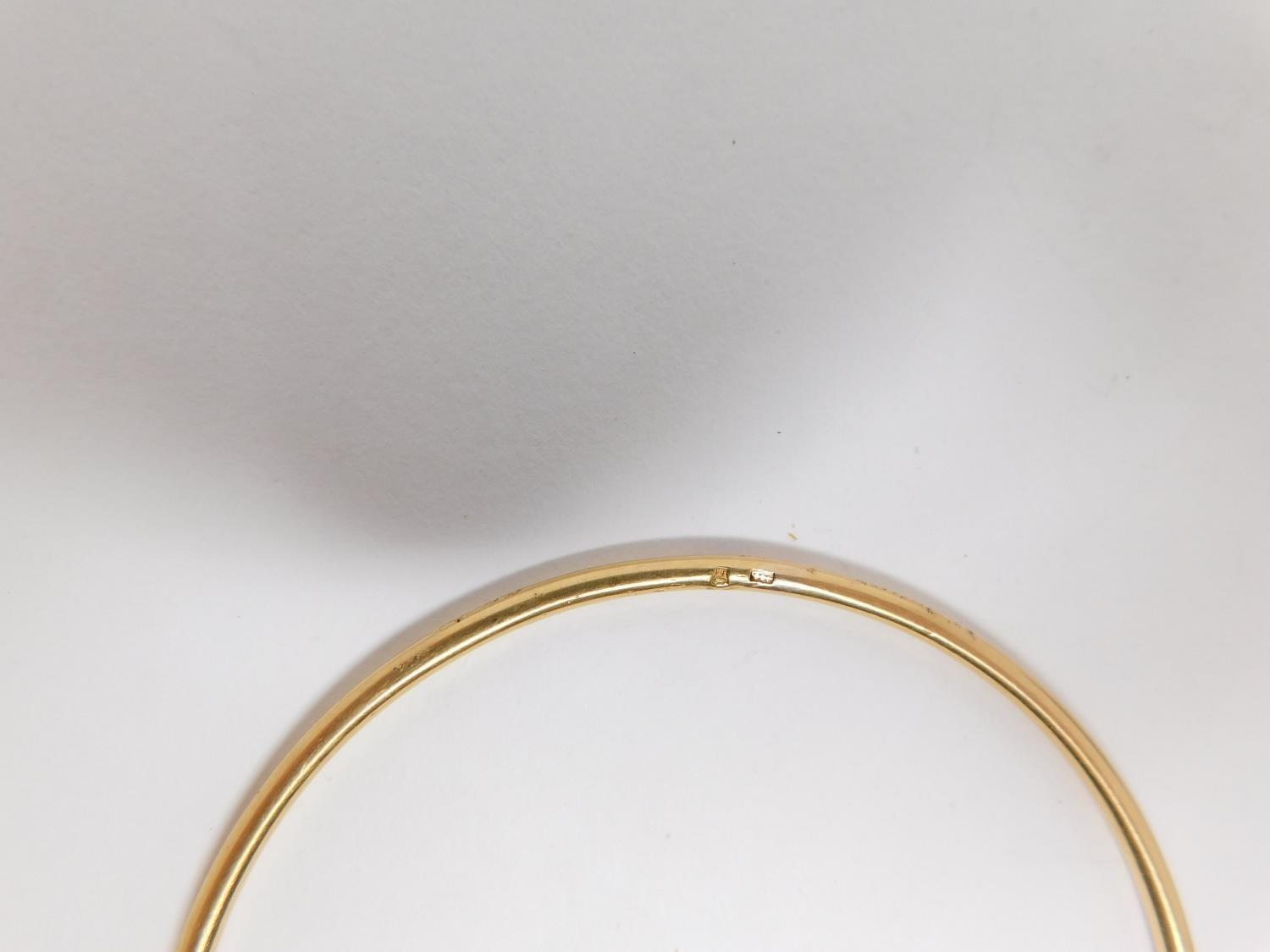 A yellow metal bangle. Foreign hallmark. Weight 11.2 g, 6.3 diameter. - Image 8 of 8