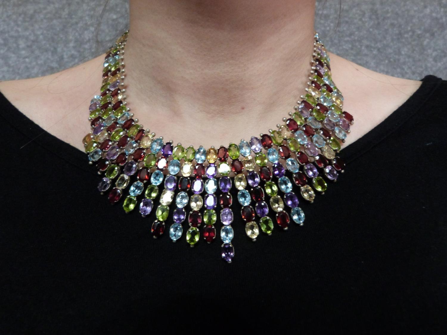A bespoke silver and multi gemstone collar necklace, set with fifty two oval mixed cut Peridots, - Image 2 of 9
