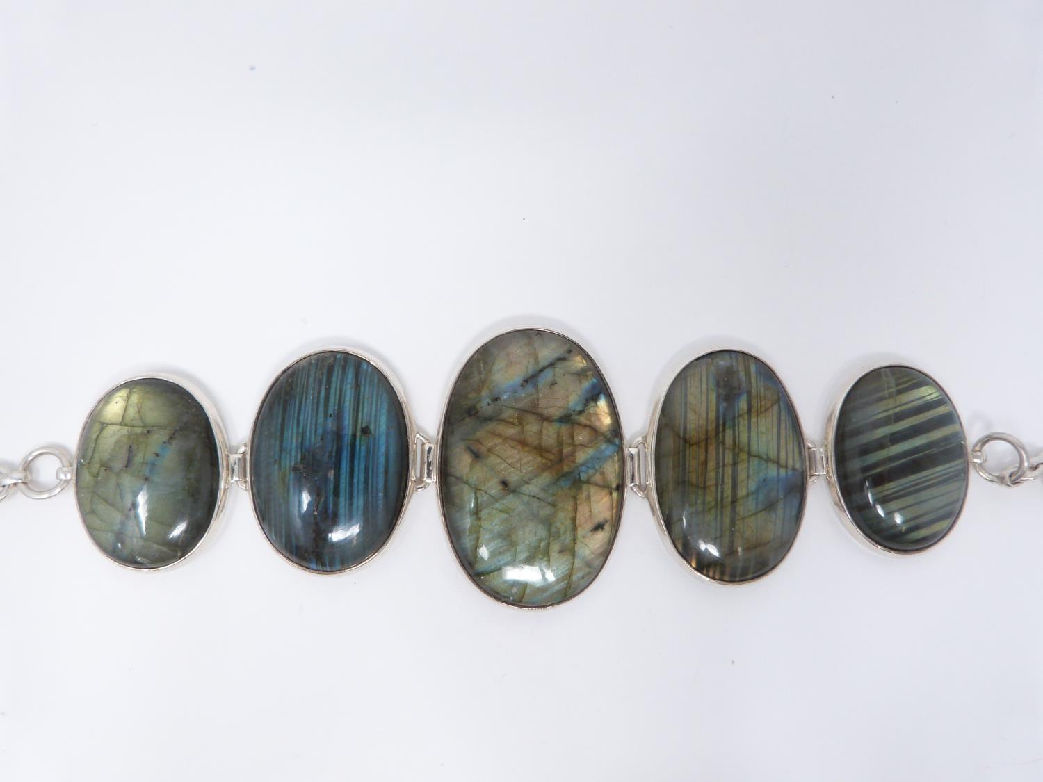 A bespoke silver and Labradorite articulated bracelet, set with five Labradorite cabochons, - Image 8 of 10