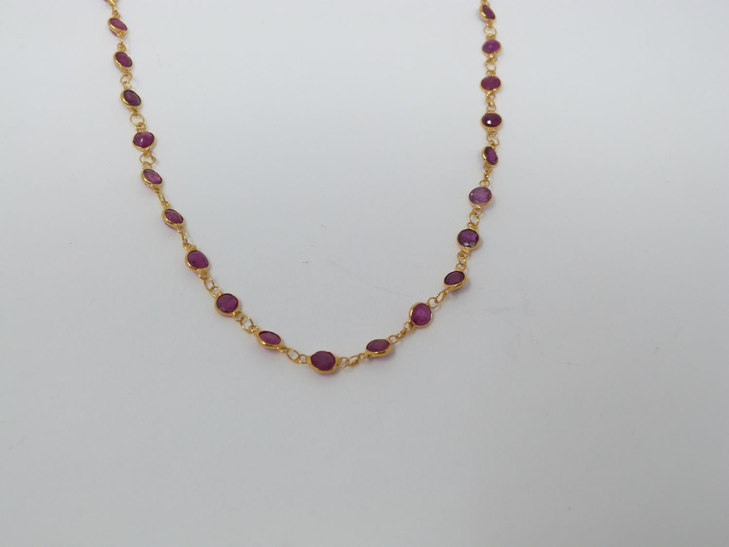 A bespoke yellow metal (tested 14 carat yellow gold) and ruby chain necklace. Set with fifty one - Image 3 of 6