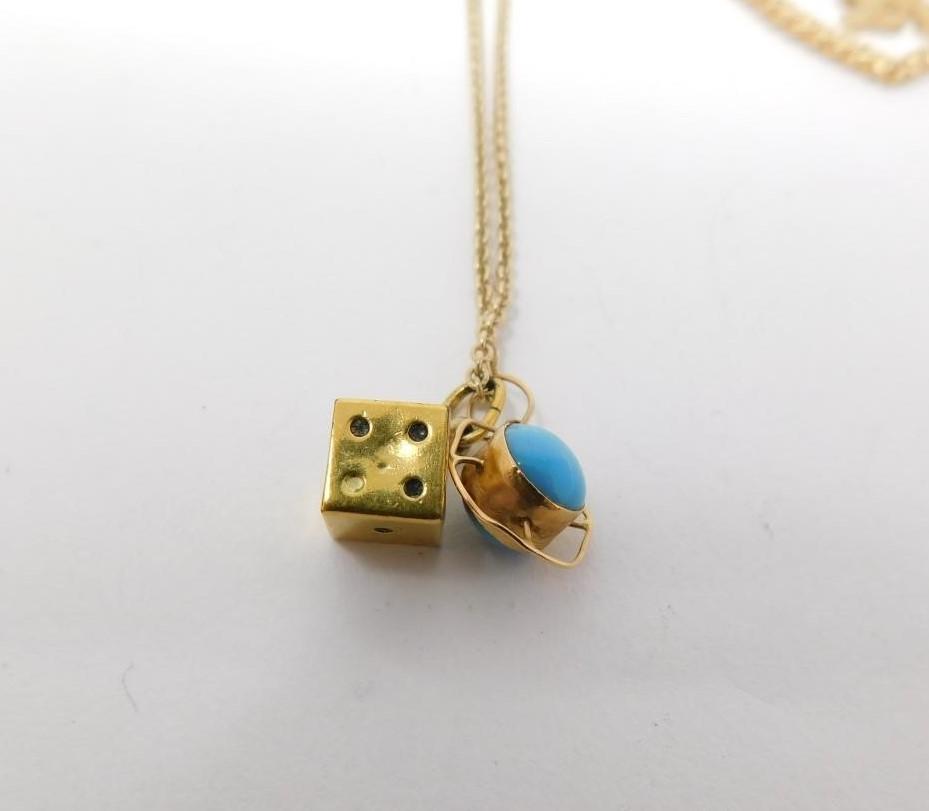 A 9carat gold chain with yellow metal dice charm and three 9 carat gold pendants. One pendant - Image 2 of 11