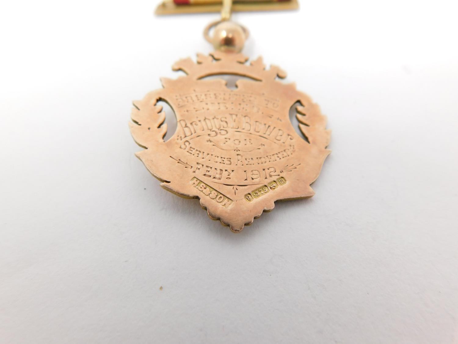 A 9 ct rose gold and enamel engraved Masonic lodge 1423 medal on an embroidered silk ribbon. - Image 7 of 8