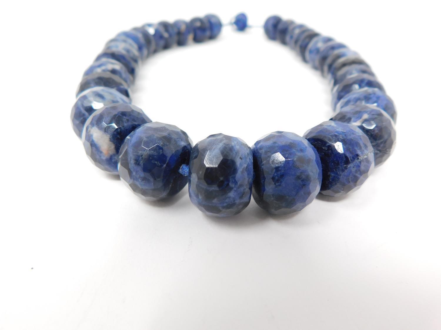 A honeycomb faceted Sodalite bead nacklace with Lapis Lazuli silk chord loop clasp. Comprised of - Image 3 of 10