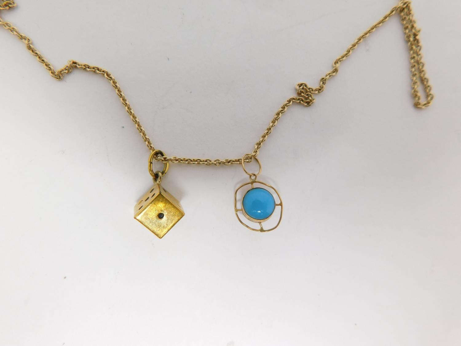 A 9carat gold chain with yellow metal dice charm and three 9 carat gold pendants. One pendant - Image 4 of 11