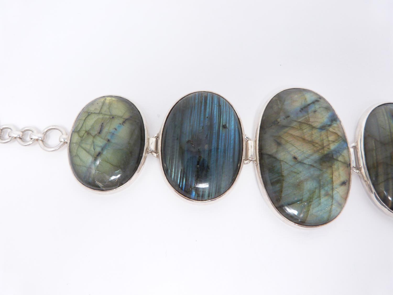 A bespoke silver and Labradorite articulated bracelet, set with five Labradorite cabochons, - Image 3 of 10