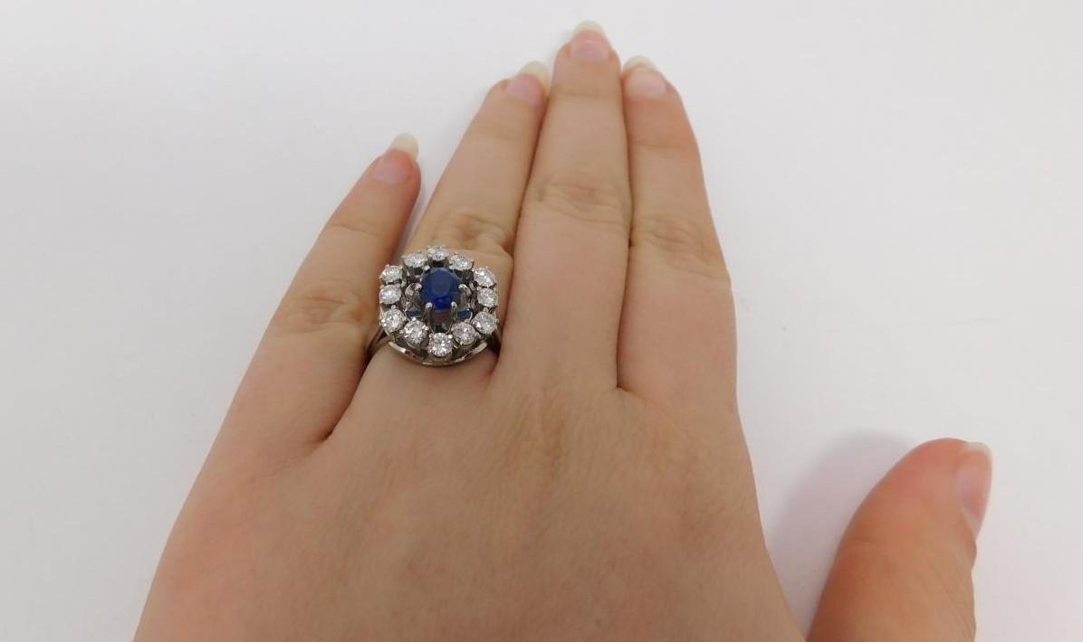 A vintage 14 carat white gold sapphire and diamond cluster ring. Set to center with an oval mixed - Image 9 of 11