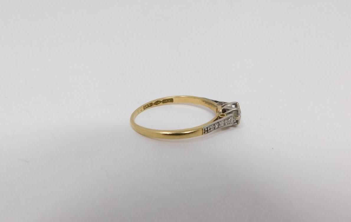 A 18 carat yellow gold and platinum flanked solitaire ring. Set to centre with a round brilliant cut - Image 2 of 8