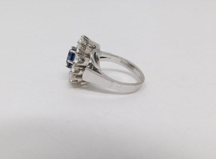 A vintage 14 carat white gold sapphire and diamond cluster ring. Set to center with an oval mixed - Image 2 of 11