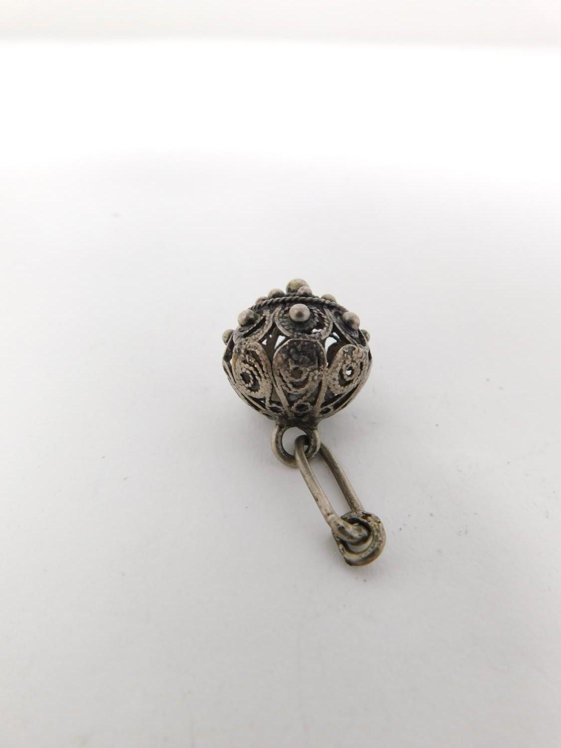 An antique Chinese engraved white metal bangle and toggle buttons. The bangle is engraved with a - Image 11 of 14