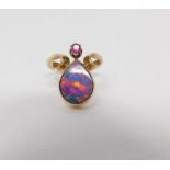 A Black Opal doublet Art Nouveau style ring, set with a drop shape Black Opal doublet and a