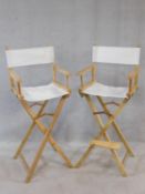 A pair of folding director's style high chairs. H.120cm