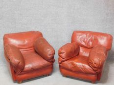 A pair of vintage Poltrona Frau easy armchairs in burgundy leather upholstery. H.74 W.87 D.110cm