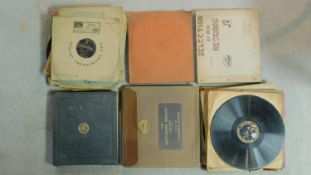 A collection of 78 rpm records including albums of His Masters Voice records.