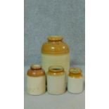 Four antique glazed stoneware jars. H.42cm