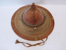 A late 19th/early 20th century Mali West African Conical leather and straw tribal Funali hat.