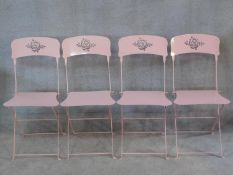 A set of four metal folding garden chairs. H.85cm