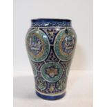 A 20th century Islamic Isnik style pottery vase, probably Moroccan, the baluster body painted with