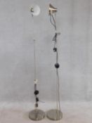 A pair of floor standing adjustable angle poise style lamps. H.157cm