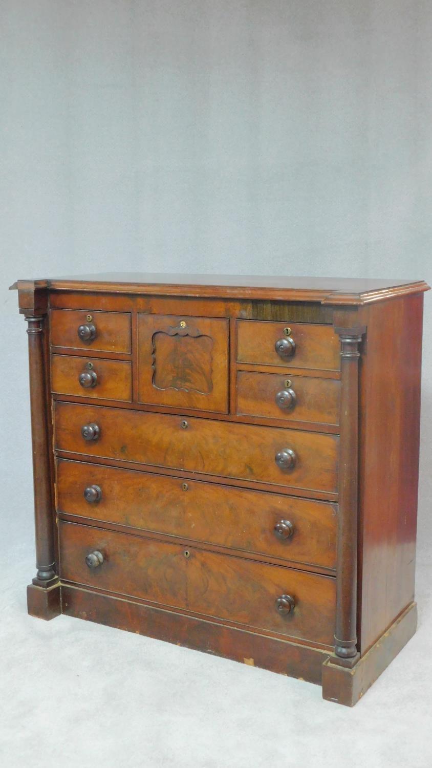 A Victorian figured mahogany chest of drawers with central hat drawer and an arrangement of seven - Image 2 of 8