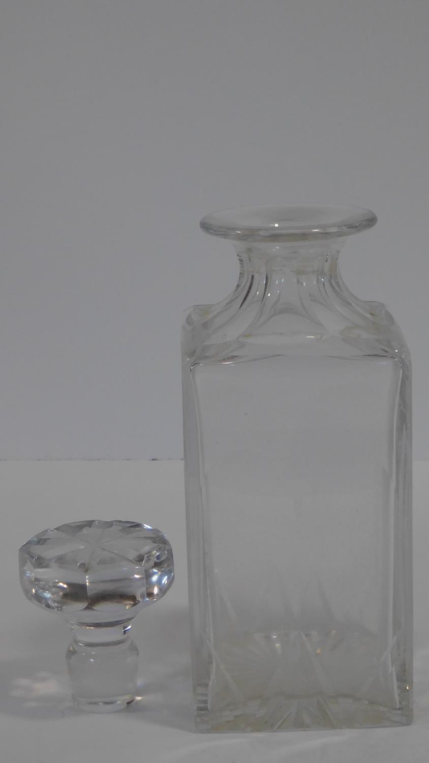 A Cartier French cut square crystal decanter with star cut design stopper. Signed to the base. H. - Image 4 of 6