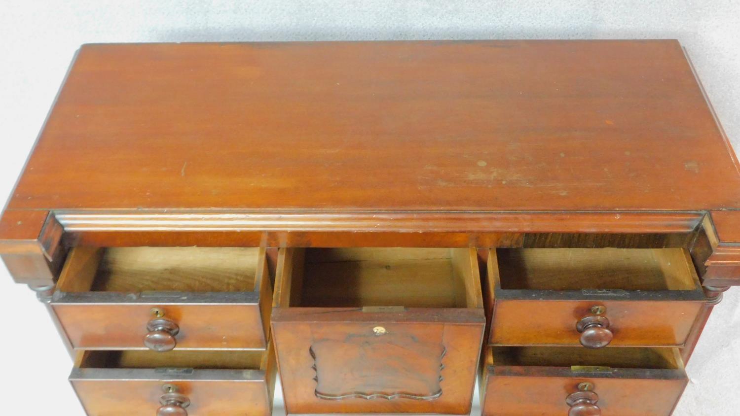 A Victorian figured mahogany chest of drawers with central hat drawer and an arrangement of seven - Image 4 of 8