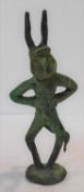 An antique pagan/erotica bronze devil figure on circular base. H.19cm