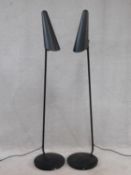 A pair of contemporary floor standing matt black adjustable reading lights. H.143cm