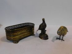 A collection of vintage brass items, grouse and partridge figures and a miniature pierced jardiniere