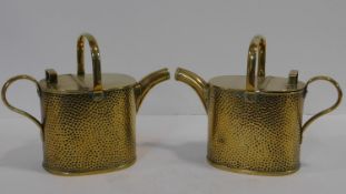 A pair of small brass 19th century conservatory watering cans with maker's stamp to the base. H.22