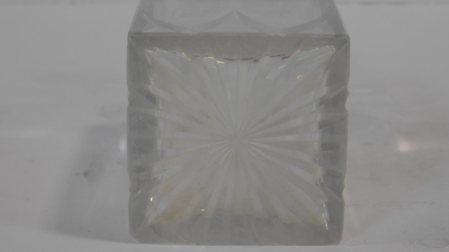 A Cartier French cut square crystal decanter with star cut design stopper. Signed to the base. H. - Image 6 of 6