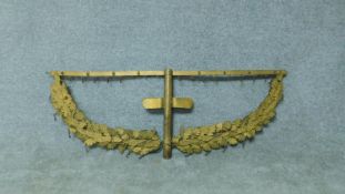 An antique gilded brass bracket with individual oak leaf decoration and hanging clip hooks. H.36 W.