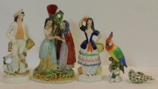 A collection of antique hand painted porcelain figures. Including two Staffordshire figures, a