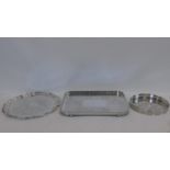 A rounded rectangular floral etched silver plated tray with pierced gallery, a similar circular tray