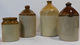 A collection of 19th century stoneware jugs and flasks, two with maker's marks to the necks. H.40cm