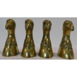 Two pairs of brass bookends in the form of eagle heads. H.17cm